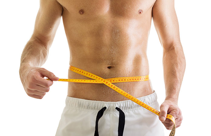 man-losing-weight-measuring-waist