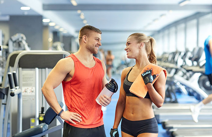 men-women-gym-exercising